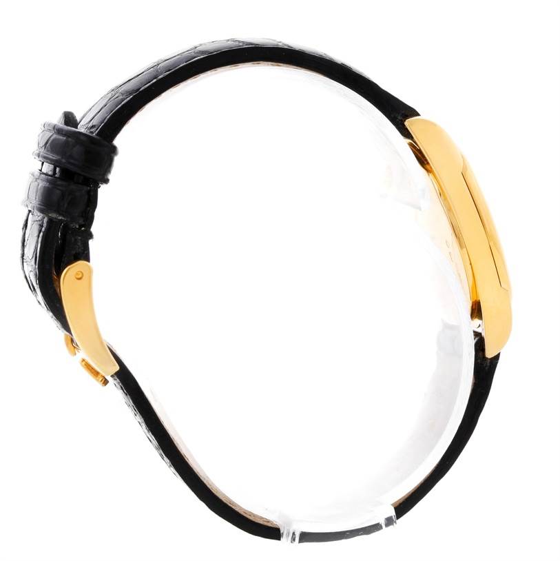 The photo shows a side view of a gold Rolex Cellini 6229 Women's Yellow Gold Black Dial 6229 Women's Yellow Gold Black Dial watch with a black leather strap.