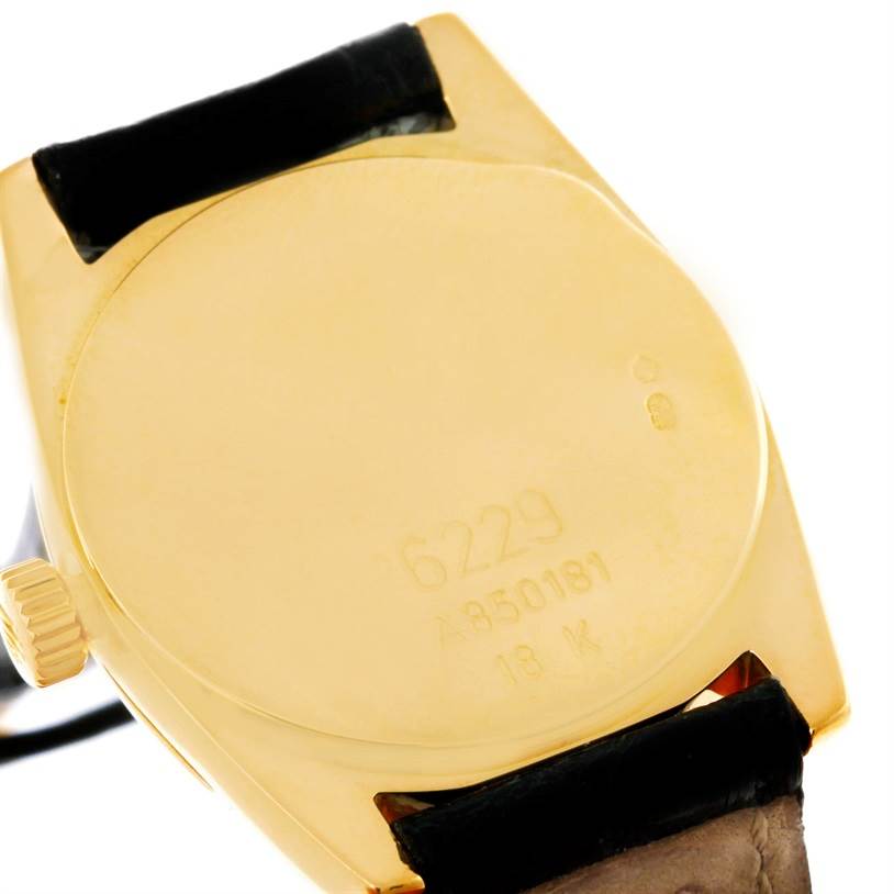 This image shows the backside and part of the strap of a Rolex Cellini 6229 Women's Yellow Gold Black Dial 6229 Women's Yellow Gold Black Dial watch, revealing the model number and hallmarks.