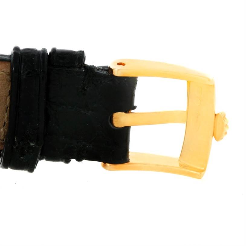 This image shows a close-up view of the buckle and part of the black leather strap for a Rolex Cellini 6229 Women's Yellow Gold Black Dial 6229 Women's Yellow Gold Black Dial watch.