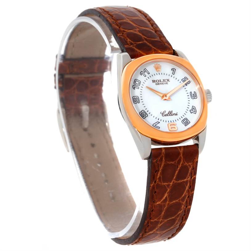 The image shows a Rolex Cellini 6229 Women's White Gold White Dial 6229 Women's White Gold White Dial watch at an angled view, highlighting its dial, crown, and brown leather strap.
