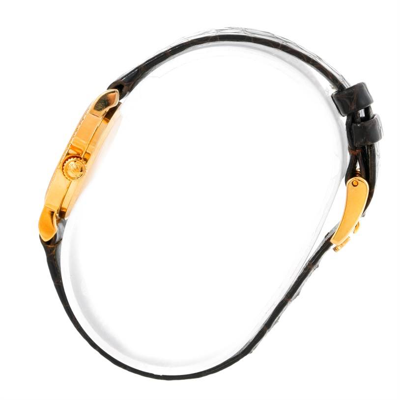 The image shows a side profile of the Rolex Cellini 5113 Women's Yellow Gold Champagne Dial 5113 Women's Yellow Gold Champagne Dial watch, highlighting its gold case, crown, and leather strap.