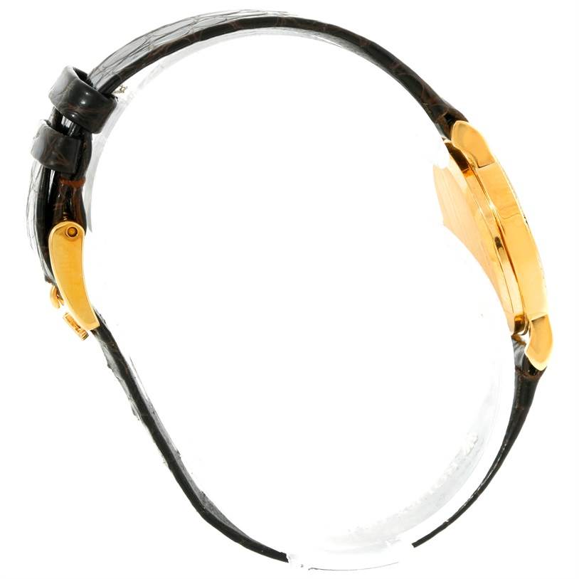 The image shows a side view of a Rolex Cellini 5113 Women's Yellow Gold Champagne Dial 5113 Women's Yellow Gold Champagne Dial watch, highlighting its gold case and black leather strap.