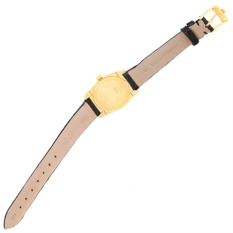 This image shows the back view of a Rolex Cellini 5310 Women's Yellow Gold Mother of Pearl Dial 5310 Women's Yellow Gold Mother of Pearl Dial watch, displaying its gold case, leather strap, and buckle.