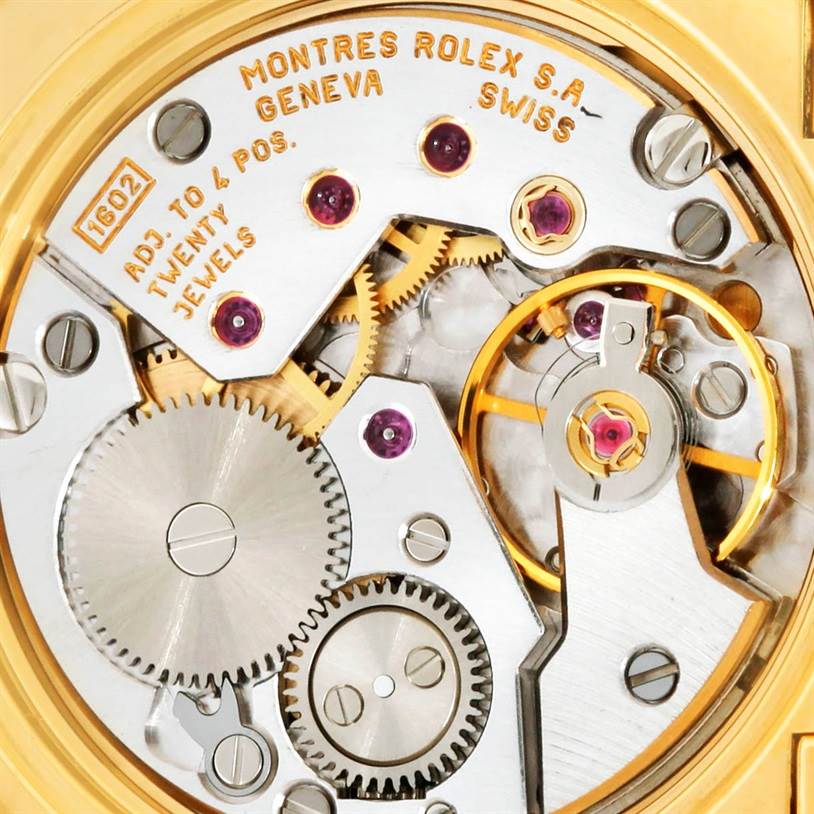This macro shot shows the intricate internal movement of the Rolex Cellini 5310 Women's Yellow Gold Mother of Pearl Dial 5310 Women's Yellow Gold Mother of Pearl Dial watch, revealing gears, jewels, and the balance wheel.