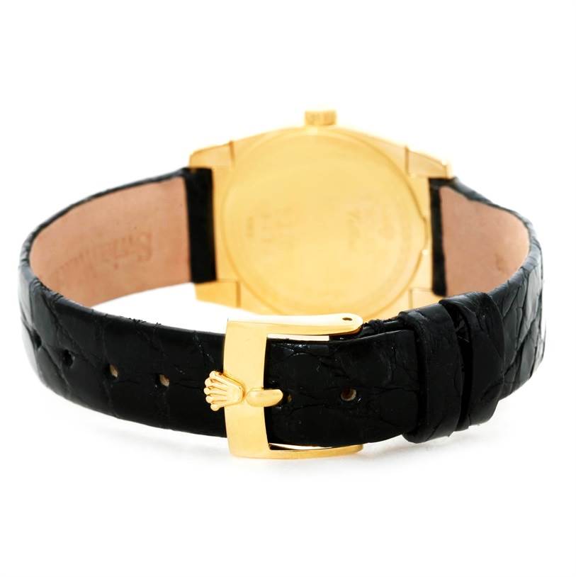 The image shows the back and clasp of a Rolex Cellini 5310 Women's Yellow Gold Mother of Pearl Dial 5310 Women's Yellow Gold Mother of Pearl Dial with a black leather strap and gold buckle, viewed from the rear.