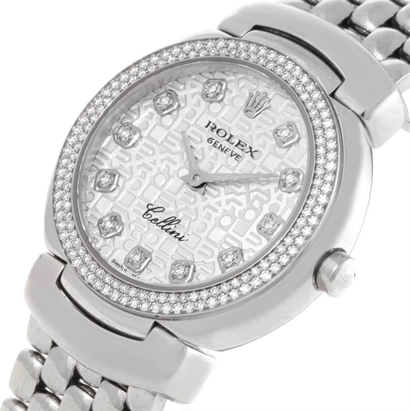 The image shows a close-up of the dial and bracelet of a Rolex Cellini 6671 Women's White Gold Silver Dial 6671 Women's White Gold Silver Dial watch, highlighting its intricate design and diamond accents.