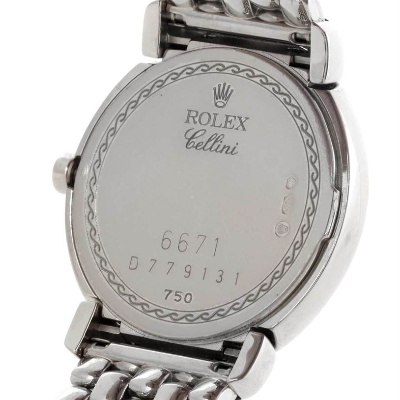 This image shows the back casing and part of the metal band of the Rolex Cellini 6671 Women's White Gold Silver Dial 6671 Women's White Gold Silver Dial model watch.