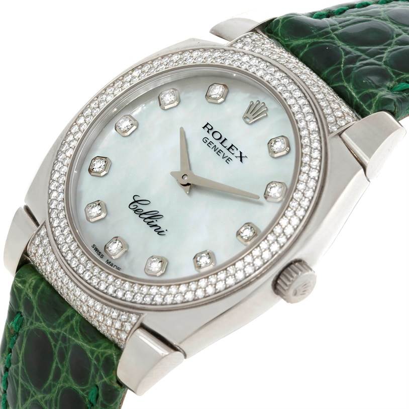 This Rolex Cellini 6321 Women's White Gold Mother of Pearl Dial 6321 Women's White Gold Mother of Pearl Dial watch is shown from a slight side angle, displaying its diamond-studded bezel, dial, and green leather strap.