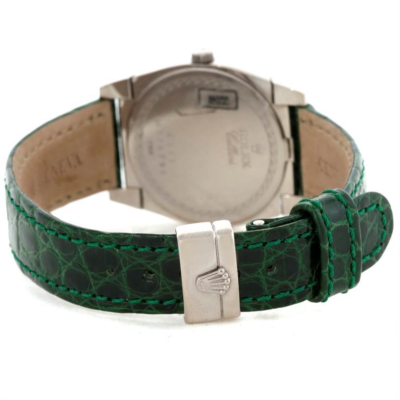 The image shows the back view of a Rolex Cellini 6321 Women's White Gold Mother of Pearl Dial 6321 Women's White Gold Mother of Pearl Dial watch, highlighting the green leather strap and clasp with the Rolex logo.