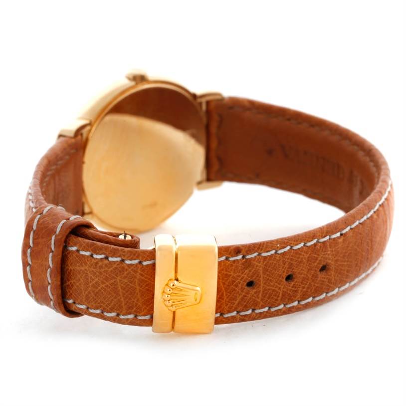 The image shows a rear view of a Rolex Cellini 6621 Women's Yellow Gold Champagne Dial 6621 Women's Yellow Gold Champagne Dial model watch, highlighting the leather strap and gold clasp.
