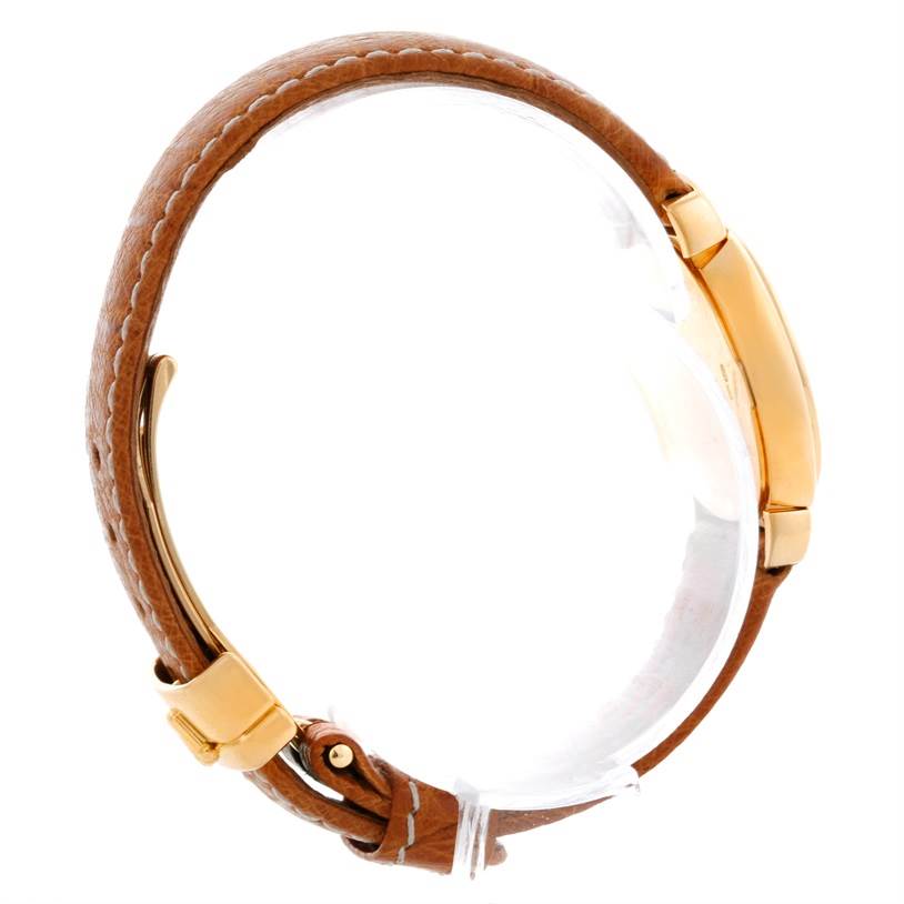 The image shows a side view of a Rolex Cellini 6621 Women's Yellow Gold Champagne Dial 6621 Women's Yellow Gold Champagne Dial watch highlighting its round case and brown leather strap.