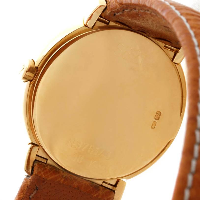 The image shows the case back of a Rolex Cellini 6621 Women's Yellow Gold Champagne Dial 6621 Women's Yellow Gold Champagne Dial watch with a brown leather strap, viewed from the rear angle.