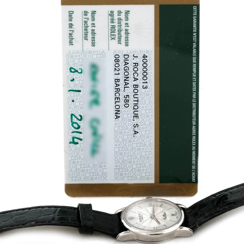 The image shows the face and strap of a Rolex Cellini 6111 Women's White Gold Silver Dial 6111 Women's White Gold Silver Dial watch, along with its warranty card.