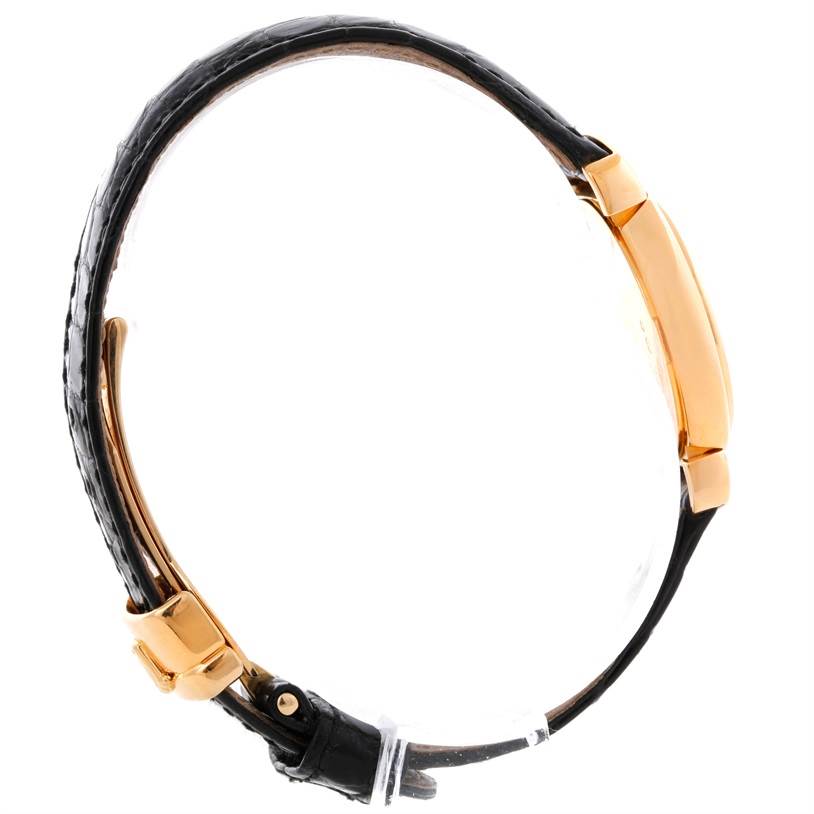 The image shows a side view of a Rolex Cellini 6621 Women's Yellow Gold White Dial 6621 Women's Yellow Gold White Dial watch, highlighting its black leather strap and gold-tone case.