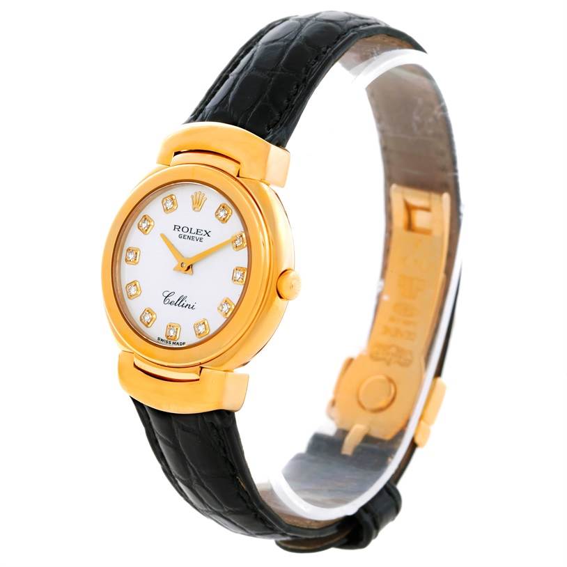 The image shows a side angle of a Rolex Cellini 6621 Women's Yellow Gold White Dial 6621 Women's Yellow Gold White Dial watch, highlighting its gold case, diamond markers, white dial, and black leather strap.