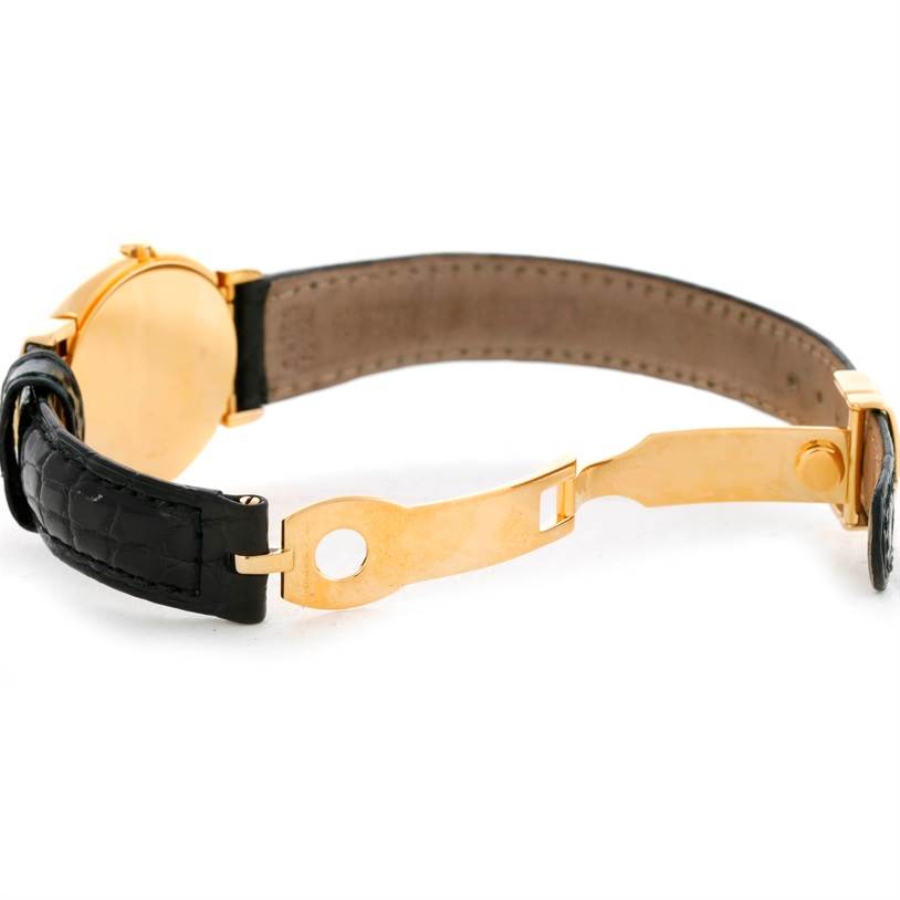 The image shows the back of a Rolex Cellini 6621 Women's Yellow Gold White Dial 6621 Women's Yellow Gold White Dial watch with its clasp and part of the leather strap.