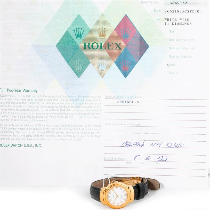 The image shows a Rolex Cellini 6621 Women's Yellow Gold White Dial 6621 Women's Yellow Gold White Dial watch, viewed from a front angle along with its warranty certificate.