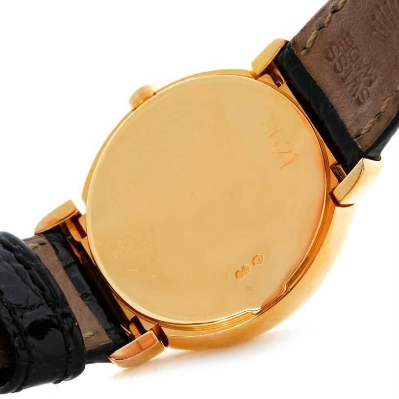 This image shows the case back and leather strap ends of a Rolex Cellini 6621 Women's Yellow Gold White Dial 6621 Women's Yellow Gold White Dial watch from an angled rear view.