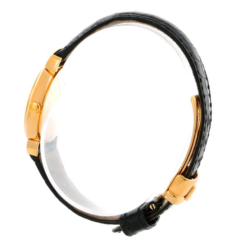 The image shows a side view of a Rolex Cellini 6621 Women's Yellow Gold White Dial 6621 Women's Yellow Gold White Dial watch, highlighting its gold case and black leather strap with the buckle.