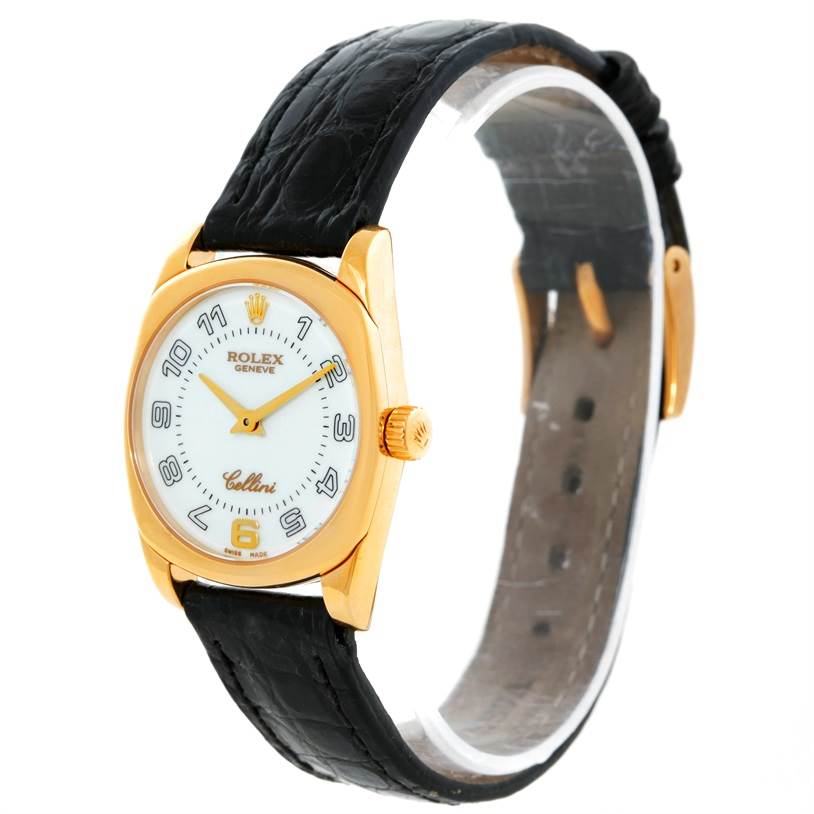 The image shows a Rolex Cellini 6229 Women's Yellow Gold White Dial 6229 Women's Yellow Gold White Dial watch from an angled side view, displaying its face, gold case, crown, and black leather strap.