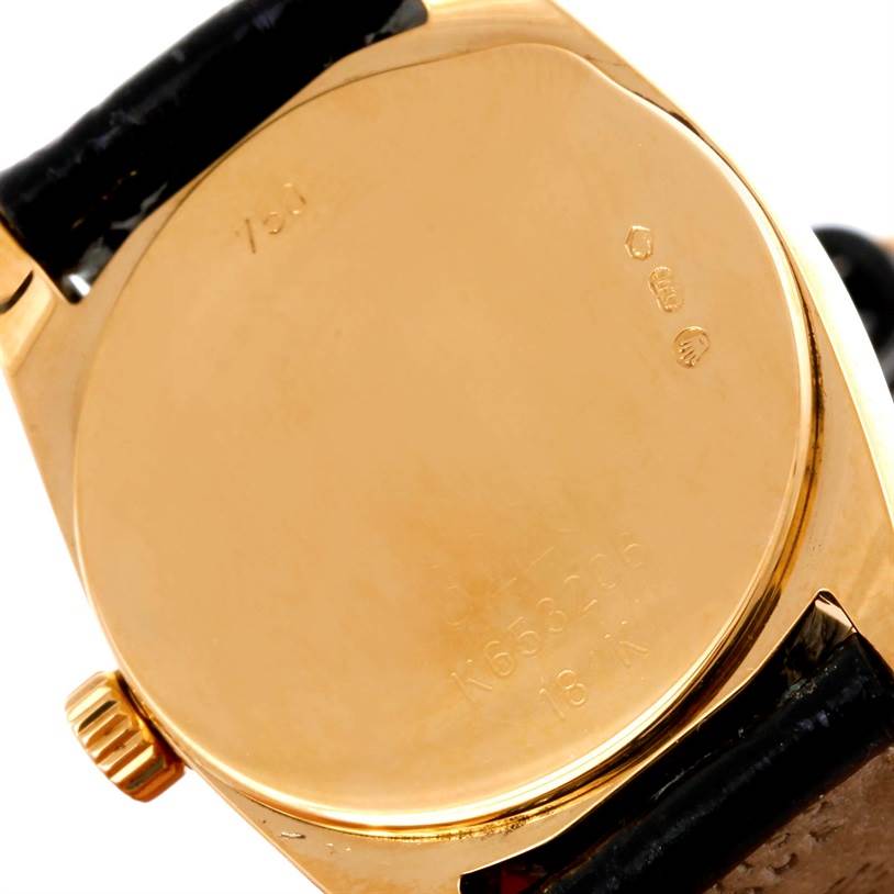 The image shows the back case and crown of a Rolex Cellini 6229 Women's Yellow Gold White Dial 6229 Women's Yellow Gold White Dial watch from a close-up angle.