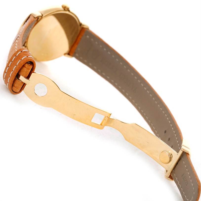 This image shows the side angle of the Rolex Cellini 6621 Women's Yellow Gold White Dial 6621 Women's Yellow Gold White Dial watch, featuring its leather strap, clasp, and partially visible case back.