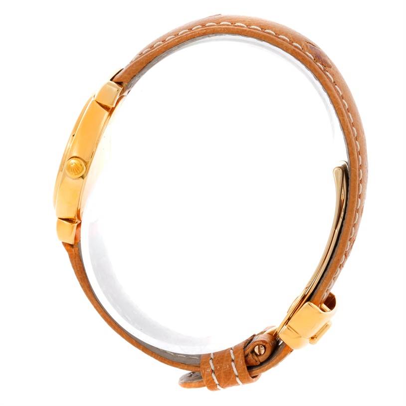 The Rolex Cellini 6621 Women's Yellow Gold White Dial 6621 Women's Yellow Gold White Dial watch is shown from the side, displaying the case, crown, and leather strap with buckle.