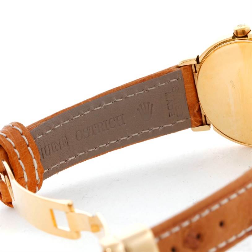 The image shows the back and inside strap of a Rolex Cellini 6621 Women's Yellow Gold White Dial 6621 Women's Yellow Gold White Dial watch, highlighting the "genuine ostrich" leather band.