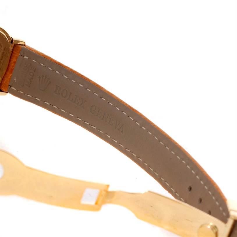 The image shows a close-up angle of the clasp and leather strap of a Rolex Cellini 6621 Women's Yellow Gold White Dial 6621 Women's Yellow Gold White Dial watch.