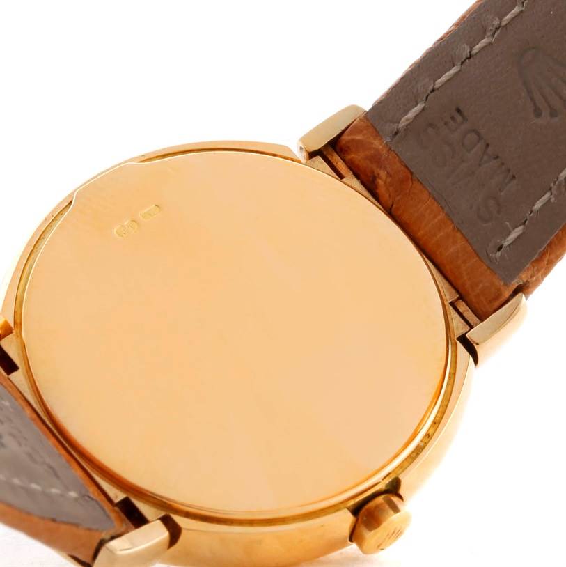 The image shows the back case and leather strap of a Rolex Cellini 6621 Women's Yellow Gold White Dial 6621 Women's Yellow Gold White Dial watch from a close-up angle.