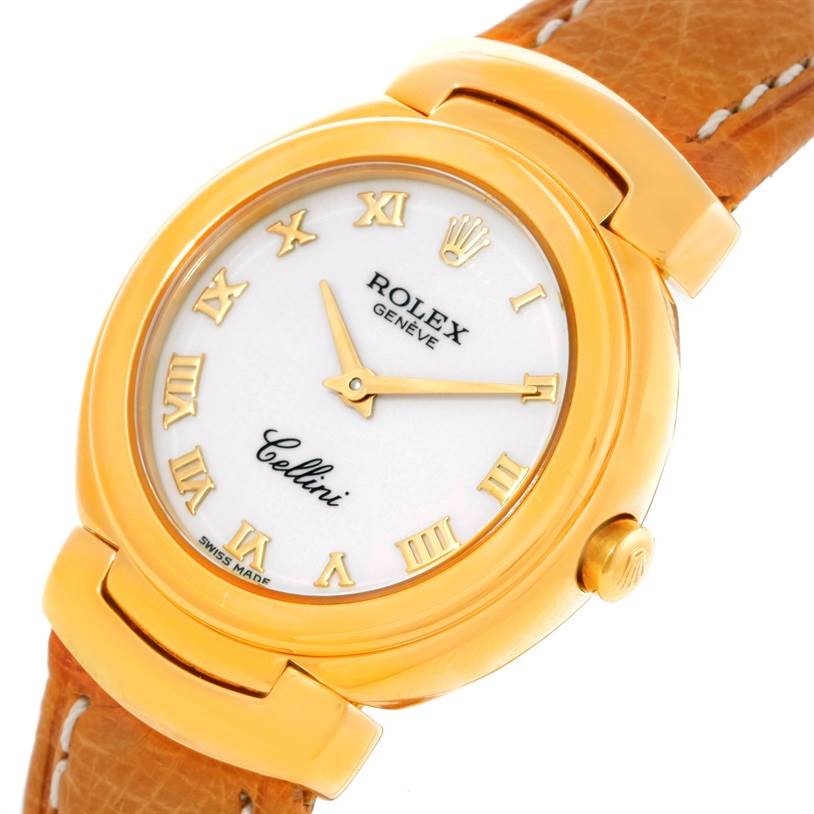 The image shows a top-angle view of a Rolex Cellini 6621 Women's Yellow Gold White Dial 6621 Women's Yellow Gold White Dial watch, highlighting its dial, case, and partial leather strap.
