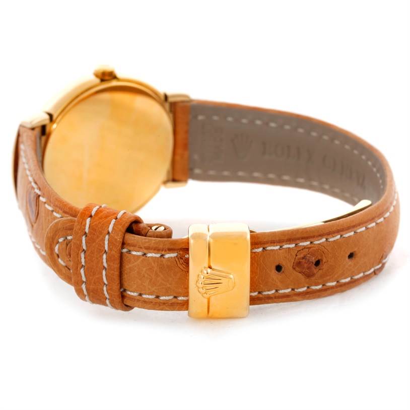 The image shows the back and clasp of the Rolex Cellini 6621 Women's Yellow Gold White Dial 6621 Women's Yellow Gold White Dial watch, highlighting its leather strap and gold details.