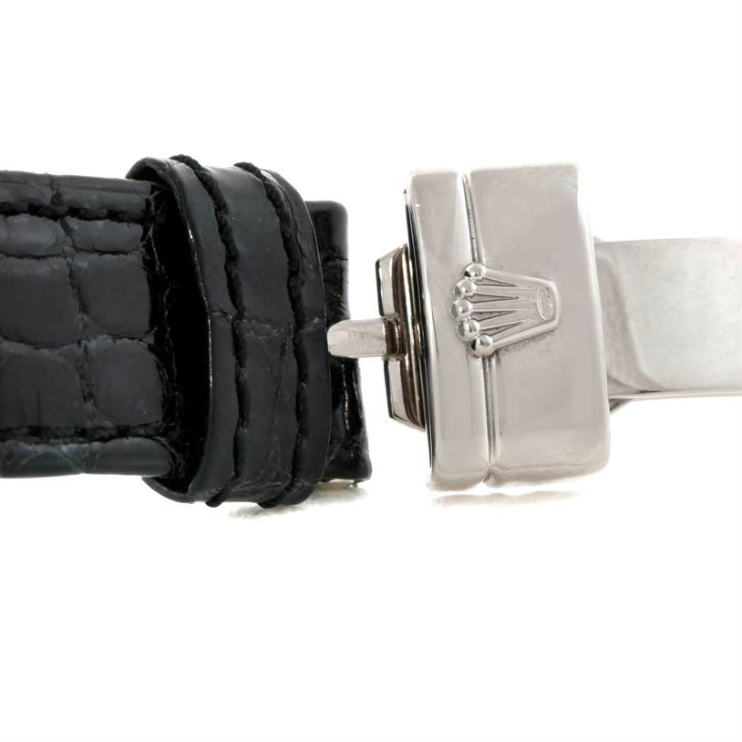 This image shows a close-up side view of a Rolex Cellini 6681 Women's White Gold White Dial 6681 Women's White Gold White Dial watch clasp and black leather strap.