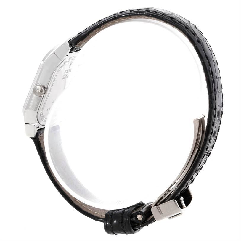 The image shows a side view of the Rolex Cellini 6691 Women's White Gold Mother of Pearl Dial 6691 Women's White Gold Mother of Pearl Dial watch, highlighting the case, crown, and black leather strap with buckle.