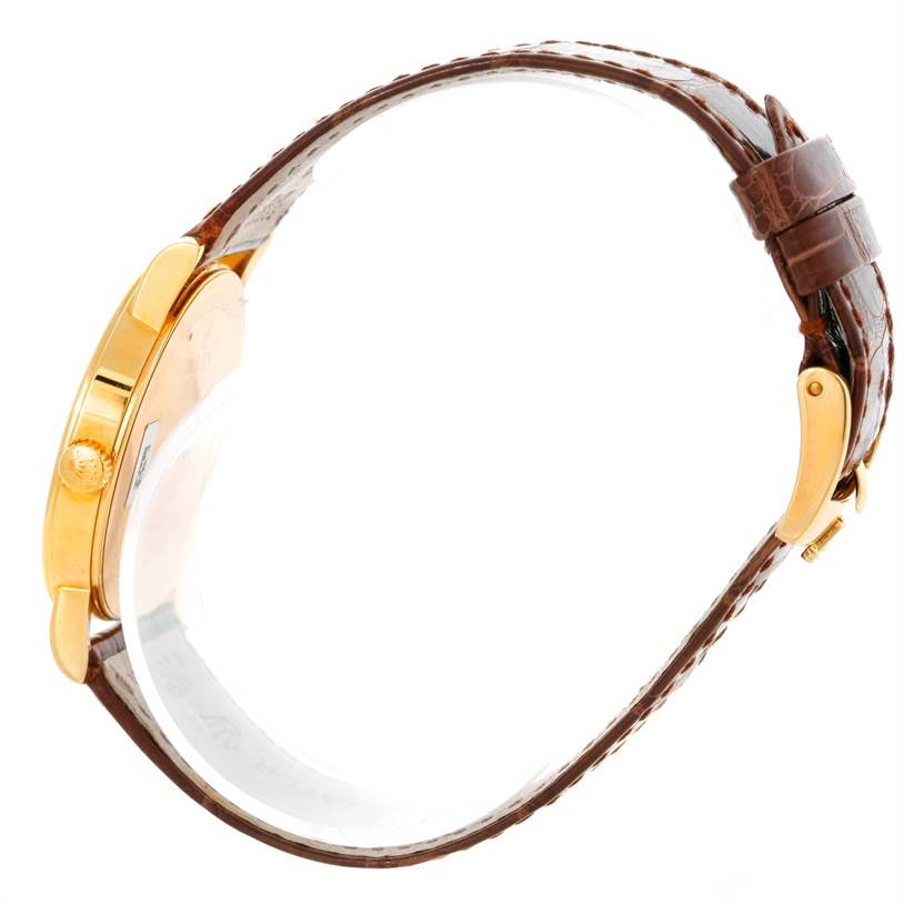 This side-view angle shows the gold case, crown, and leather strap of the Rolex Cellini 5115 Men's Yellow Gold Silver Dial 5115 Men's Yellow Gold Silver Dial model watch.