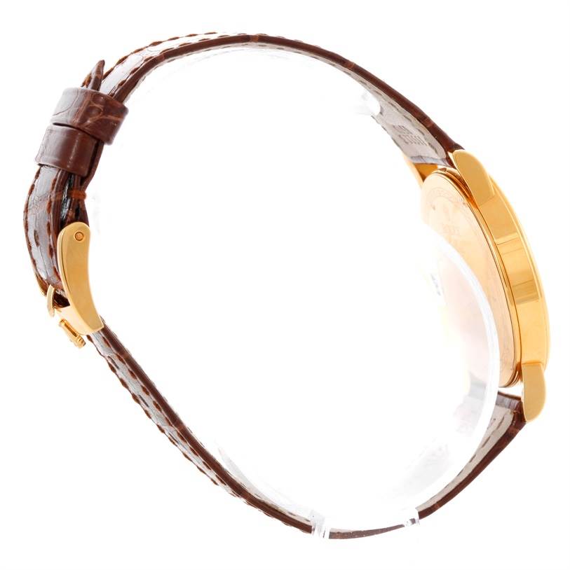 The image shows a side view of a Rolex Cellini 5115 Men's Yellow Gold Silver Dial 5115 Men's Yellow Gold Silver Dial watch, highlighting the brown leather strap and gold case.