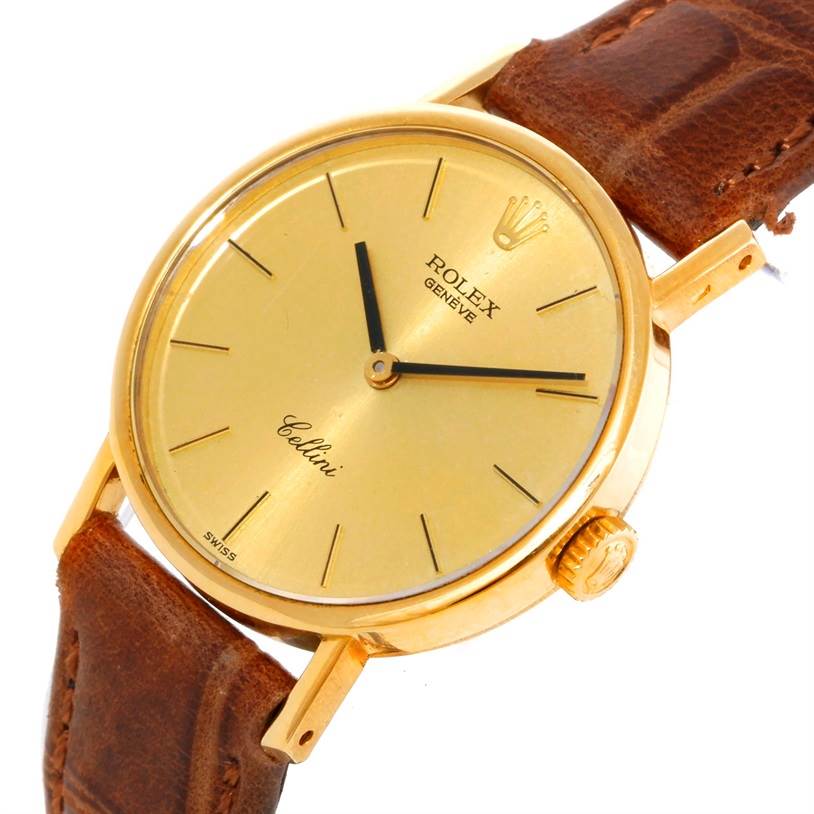 This image shows the face and case of a Rolex Cellini 5109 Women's Yellow Gold Champagne Dial 5109 Women's Yellow Gold Champagne Dial watch at a slight angle, highlighting its gold dial and leather band.