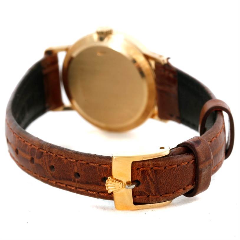 The image shows the back case and leather strap of a Rolex Cellini 5109 Women's Yellow Gold Champagne Dial 5109 Women's Yellow Gold Champagne Dial watch from a rear angle.