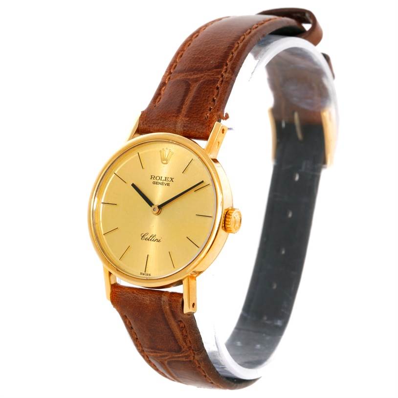 The image shows a Rolex Cellini 5109 Women's Yellow Gold Champagne Dial 5109 Women's Yellow Gold Champagne Dial watch at an angle displaying the gold dial, crown, and brown leather strap.