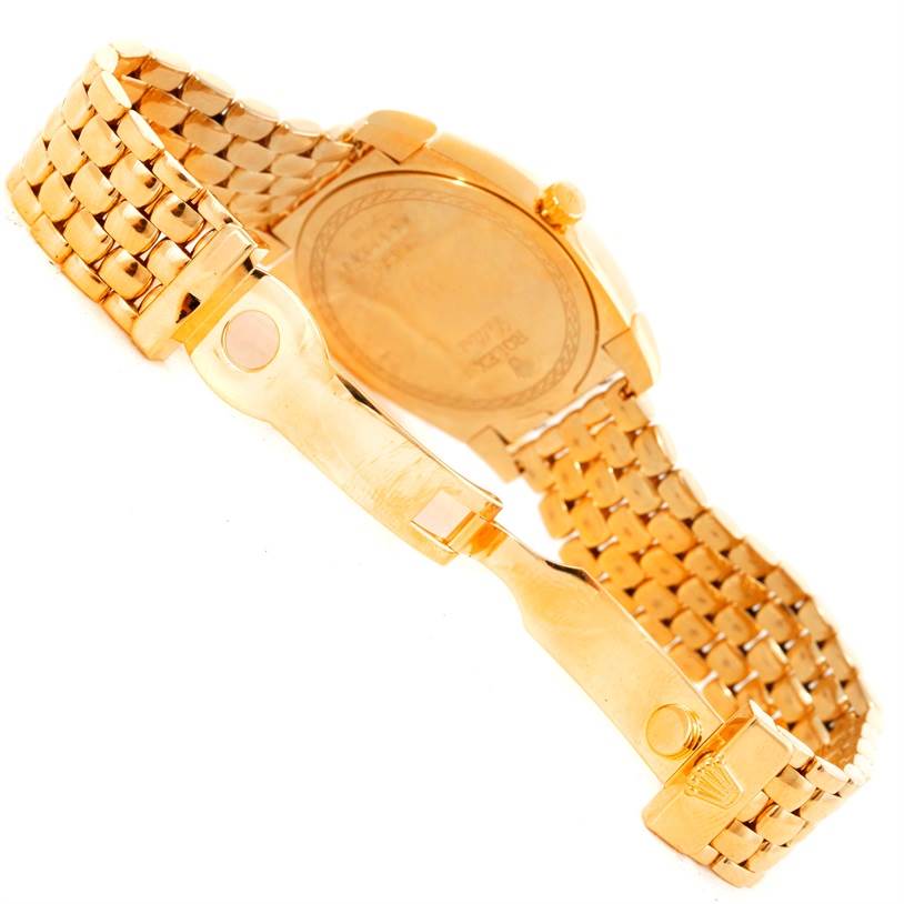 The Rolex Cellini 6321 Women's Yellow Gold Mother of Pearl Dial 6321 Women's Yellow Gold Mother of Pearl Dial watch is shown from the back, highlighting its closed clasp and gold bracelet.