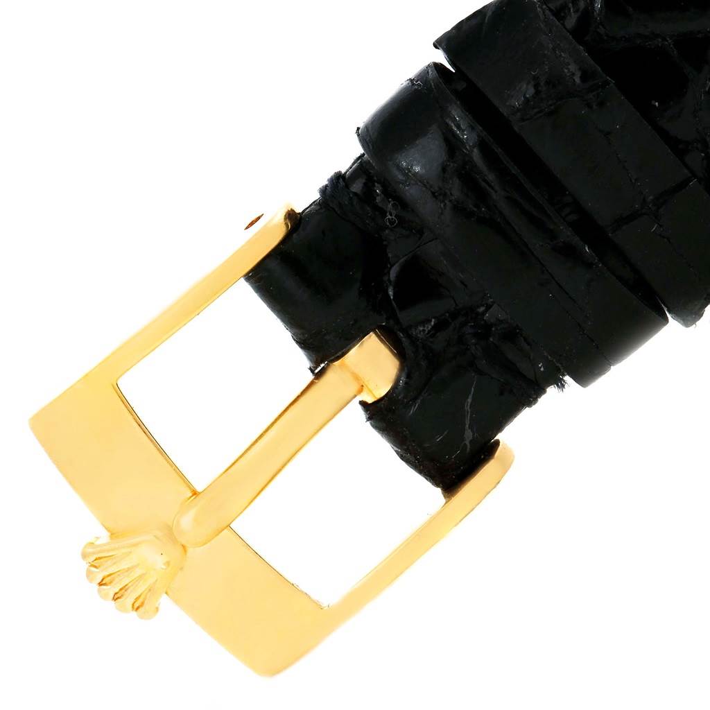 This image shows a close-up of the black leather strap and gold buckle of a Rolex Cellini 6229 Women's Yellow Gold Black Dial 6229 Women's Yellow Gold Black Dial watch.