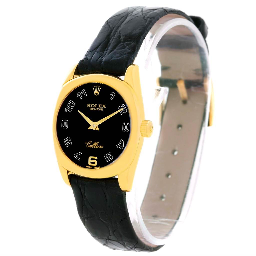 The Rolex Cellini 6229 Women's Yellow Gold Black Dial 6229 Women's Yellow Gold Black Dial watch is shown from a front angle, highlighting its black dial, gold case, and black leather strap.
