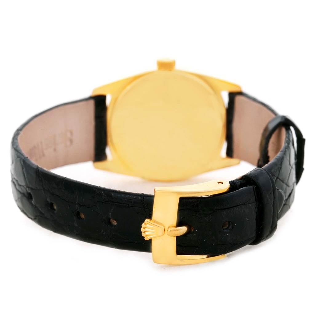 The image shows the back view of a Rolex Cellini 6229 Women's Yellow Gold Black Dial 6229 Women's Yellow Gold Black Dial watch, highlighting the gold case and black leather strap.