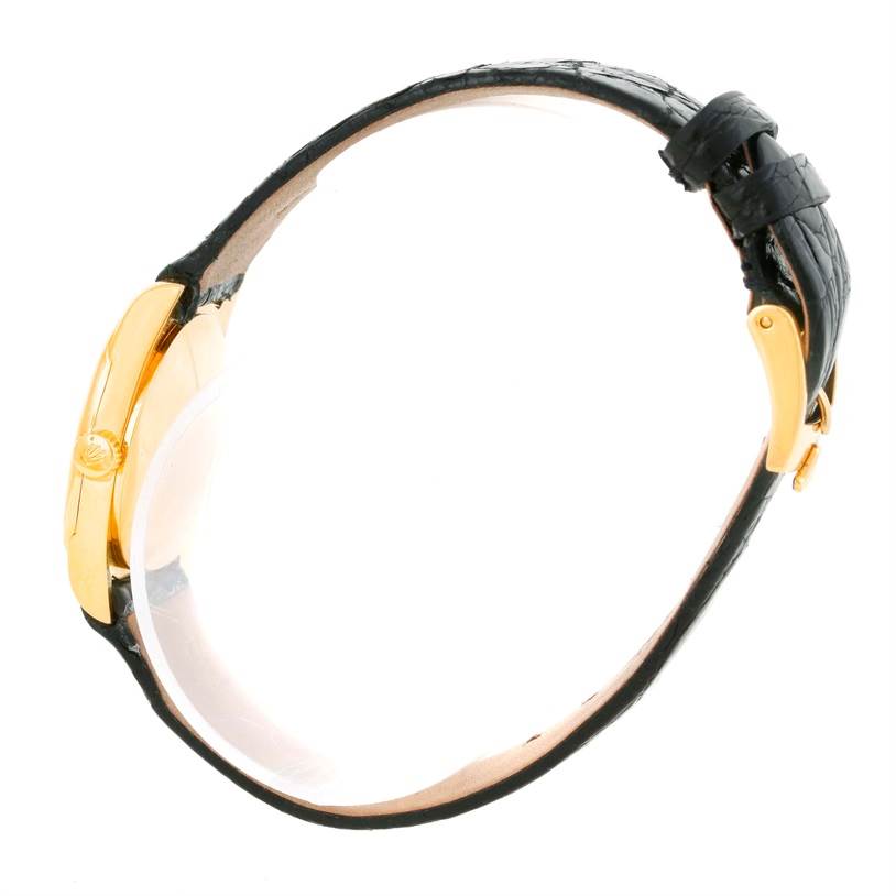 The image shows a side view of the Rolex Cellini 6229 Women's Yellow Gold Black Dial 6229 Women's Yellow Gold Black Dial watch, featuring its black leather strap and gold case.