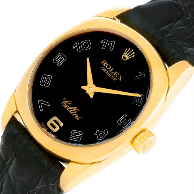 This Rolex Cellini 6229 Women's Yellow Gold Black Dial 6229 Women's Yellow Gold Black Dial watch is shown at an angled close-up, displaying its black dial, gold case, black leather strap, and crown.