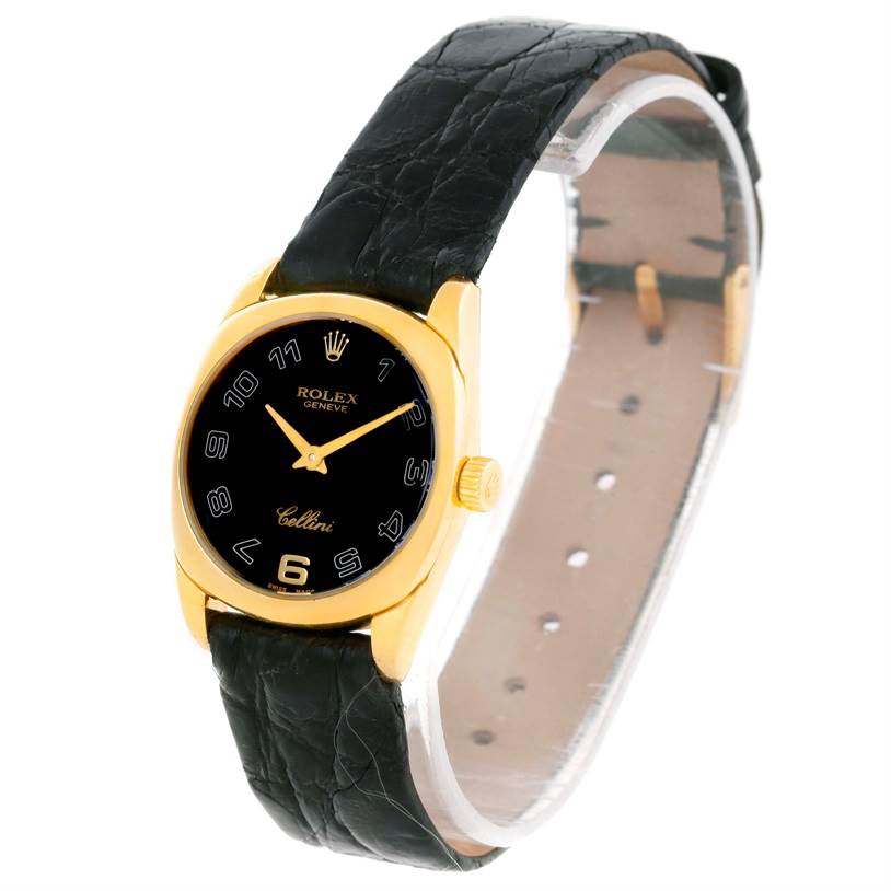 The image shows a frontal view of a Rolex Cellini 6229 Women's Yellow Gold Black Dial 6229 Women's Yellow Gold Black Dial watch with a black strap and gold casing.