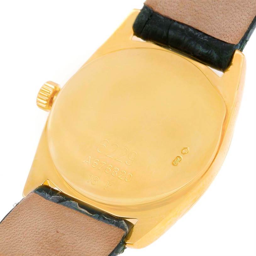 The image shows the back case and leather strap of a Rolex Cellini 6229 Women's Yellow Gold Black Dial 6229 Women's Yellow Gold Black Dial watch at an angle.