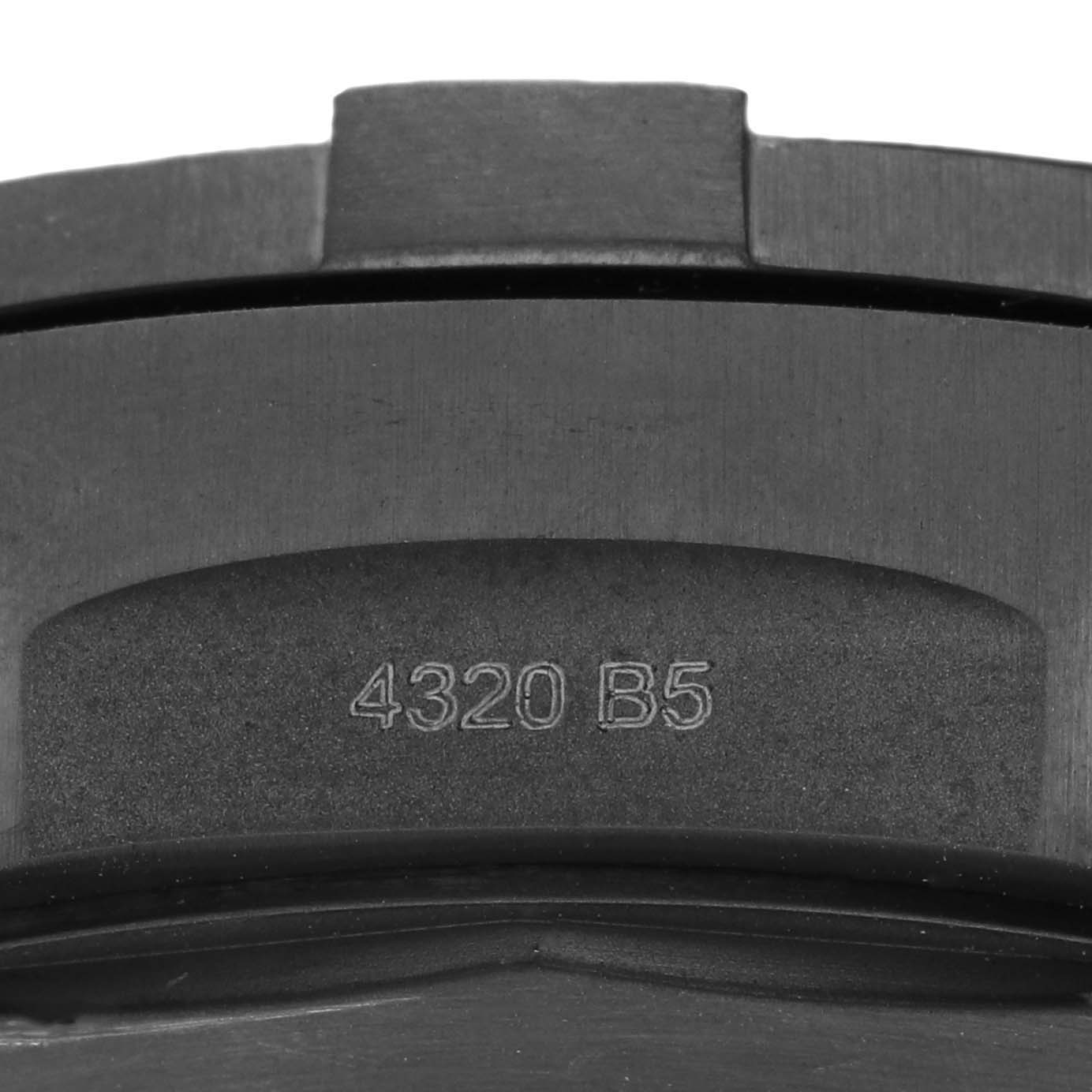 This is a close-up view of the bezel edge of a Breitling Avenger V13317101L1X2 Men's Titanium Green Dial V13317101L1X2 Men's Titanium Green Dial watch with the engraving "4320 B5."