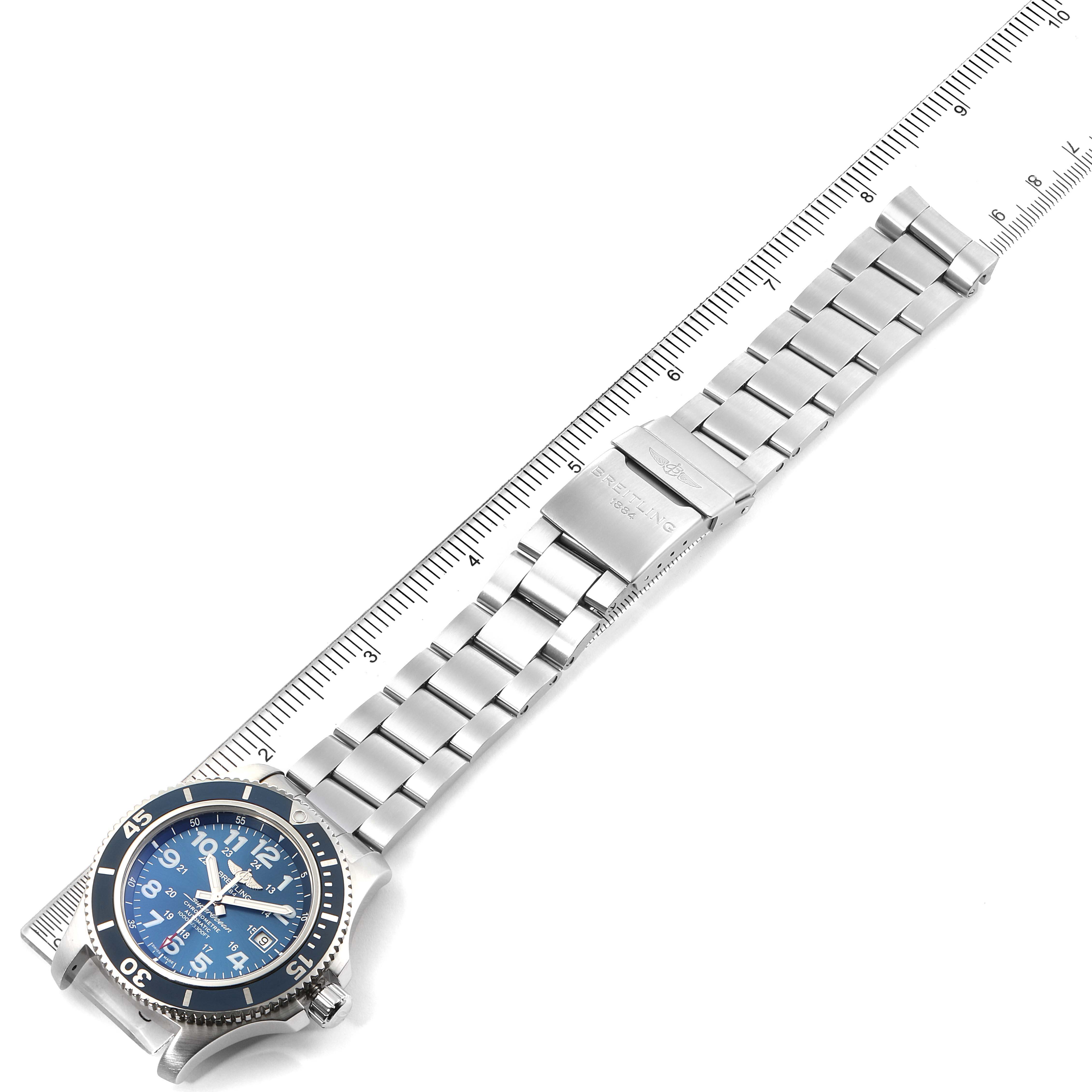 The image shows a Breitling Superocean A17392 Men
s Stainless Steel Blue Dial A17392 Men
s Stainless Steel Blue Dial watch laid flat with its metal bracelet extended, alongside a ruler for scale.