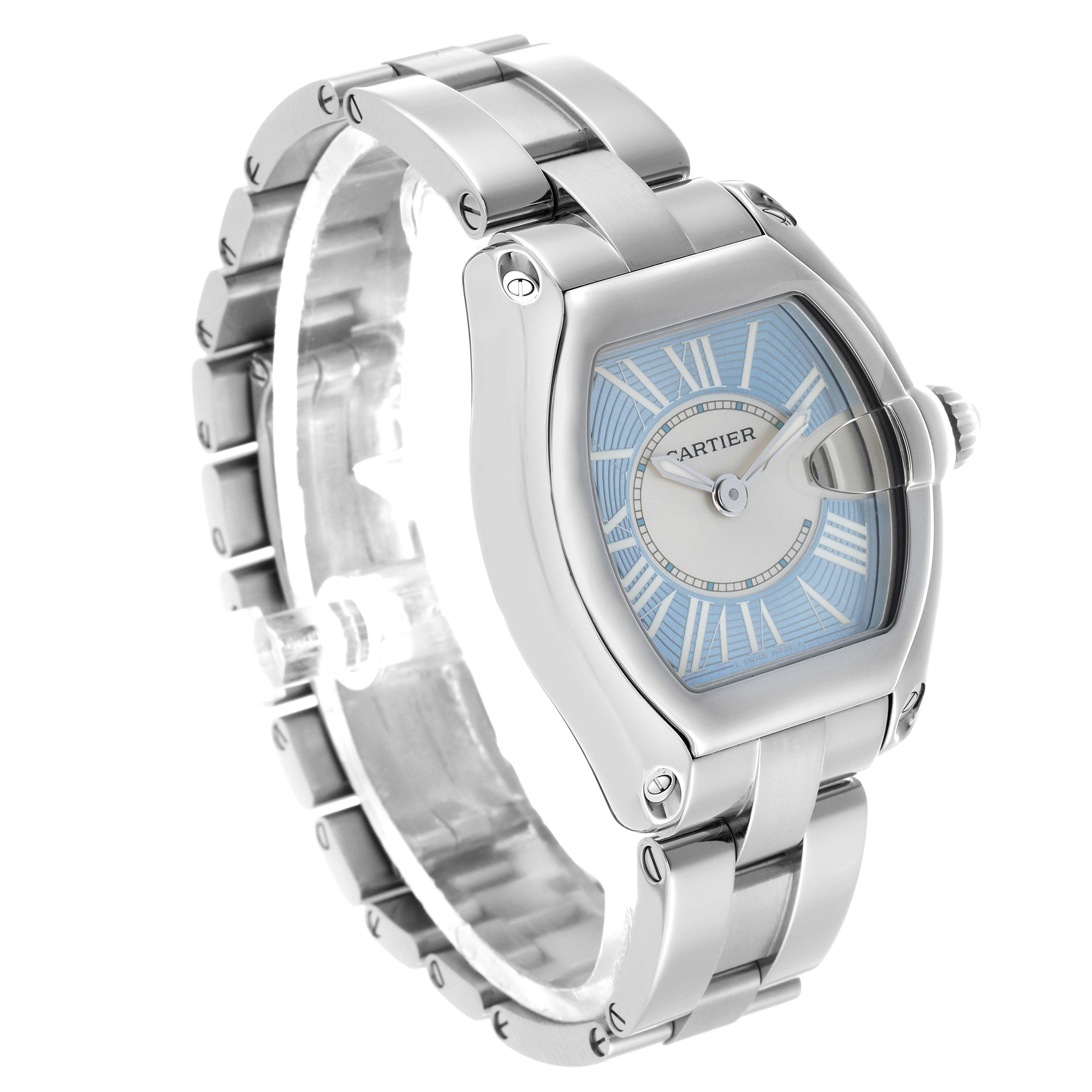 The Cartier Roadster W62053V3 Women's Stainless Steel Blue Dial watch is shown at a three-quarter angle, highlighting its case, dial, and stainless steel bracelet.